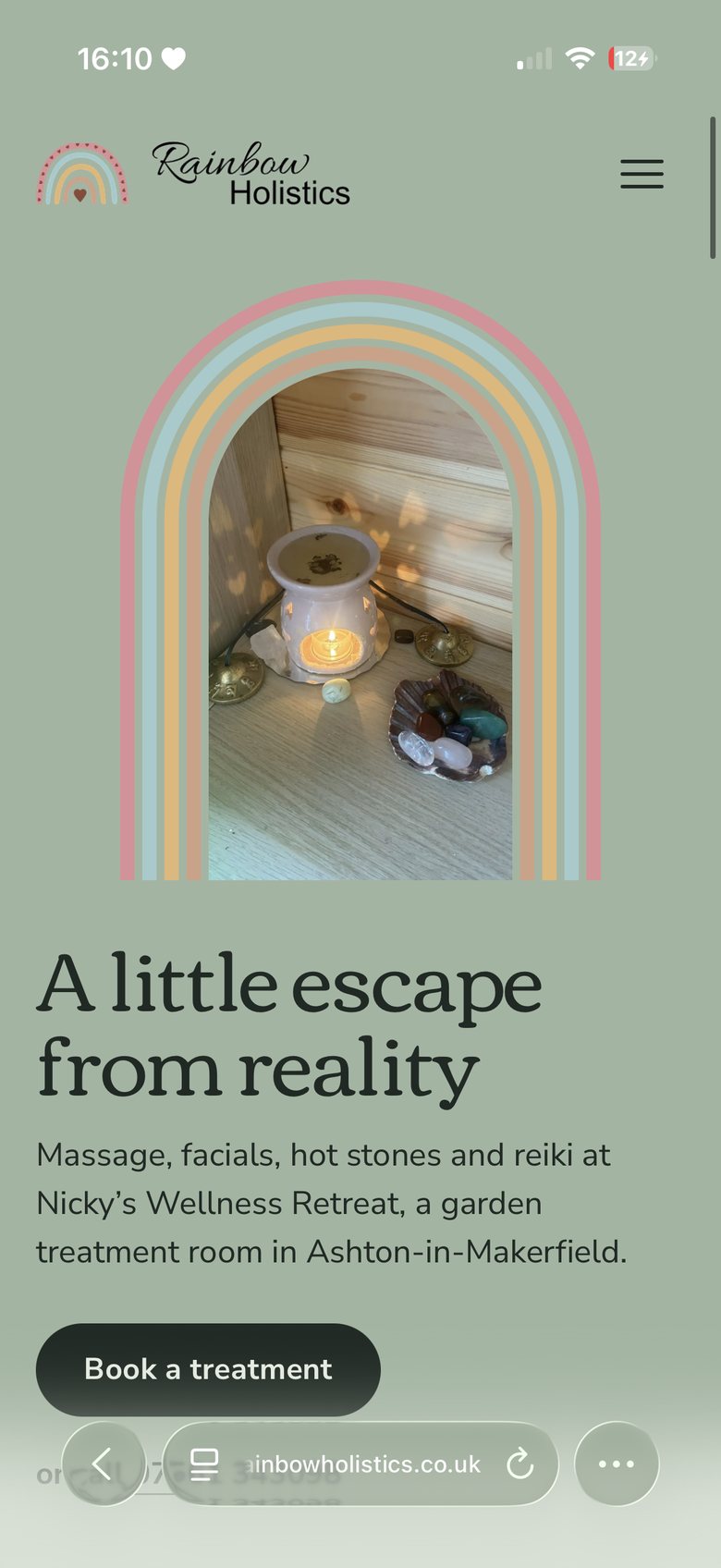 The Rainbow Holistics website on a phone